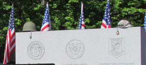 A WWII helmet and jungle hat were part of the veterans memorial at the Ortonville Cemetery. 