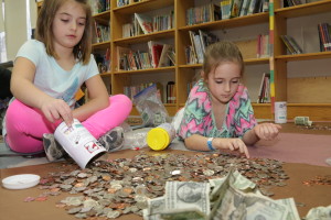 IMG_1117 Abigail Gagnon 6 1gr and Brooklyn Jordan 6 1gr are from Reid Elem are counting the money they raise for dines for diapers. March 29 17