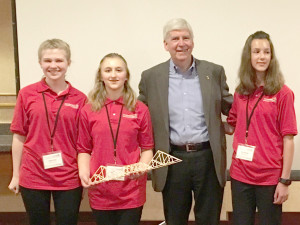 From left, Haley Solo, Sarah Pesta,Gov.-Snyder, and Kyra Burger at the state championship in Grand Rapids.