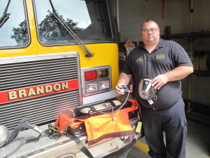 Brandon Township Fire Department Capt. Billy Starr with the rapid intervention kit.