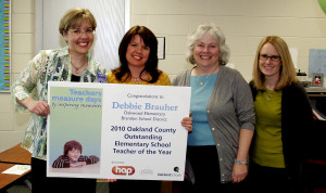 From left, Kristy Spann, then Oakwood Principal, Debbie Brauher, Lorrie McMahon, then superintendent, and Joanna McKinney, then curriculum director. Brauher won teacher of the year in 2010.