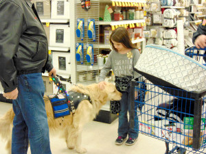 Savannah, a 7 year old Brandon student with a service dog